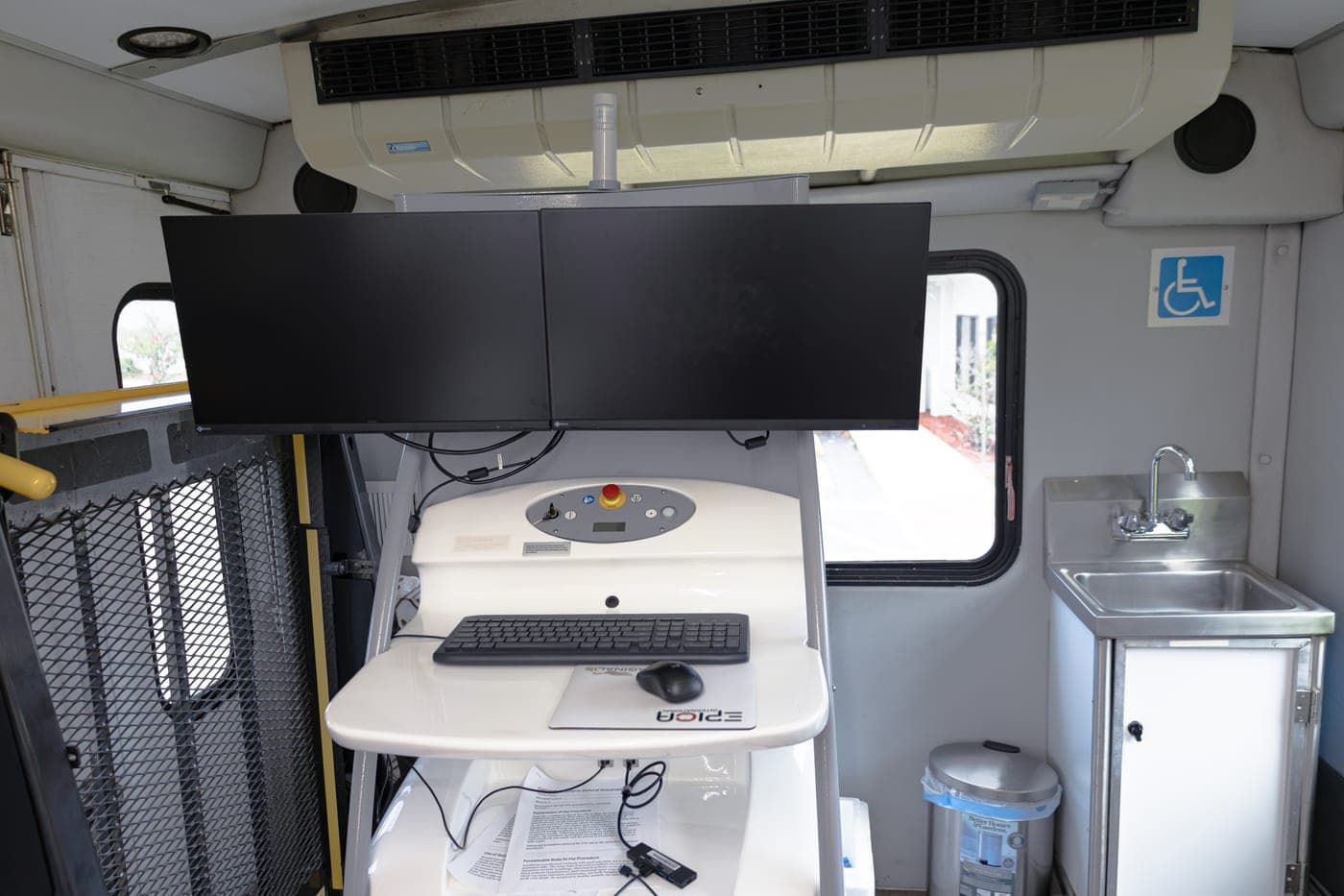 Two-monitor reading workstation inside the medical bus